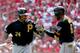 ST LOUIS, MO - OCTOBER 04: Pedro Alvarez #24 of the Pittsburgh Pirates celebrates with Starling Marte #6 in the second inning after Alvarez scores against the St. Louis Cardinals during Game Two of the National League Division Series at Busch Stadium on October 4, 2013 in St Louis, Missouri. (Photo by Elsa/Getty Images)