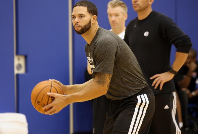Hi-res-183101372-head-coach-jason-kidd-and-deron-williams-of-the_crop_north