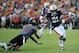 Sep 7, 2013; Auburn, AL, USA; Auburn Tigers running back Tre Mason (21) runs the ball around Arkansas State Red Wolves defensive back Sterling Young (11) at Jordan Hare Stadium. Mandatory Credit: Shanna Lockwood-USA TODAY Sports