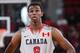 PORTLAND, OR - APRIL 20: Andrew Wiggins of the World Select Team looks on during the 2013 Nike Hoop Summit game against the USA Junior Select Team on April 20, 2013 at the Rose Garden Arena in Portland, Oregon. NOTE TO USER: User expressly acknowledges and agrees that, by downloading and or using this photograph, User is consenting to the terms and conditions of the License Agreement. Mandatory Copyright Notice: Copyright 2013 (Photo by Sam Forencich)