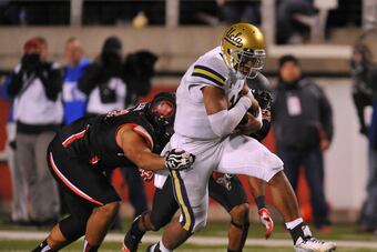 Hi-res-183074234-quarterback-brett-hundley-of-ucla-runs-for-a-fourth_crop_north