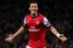 LONDON, ENGLAND - OCTOBER 01: Mesut Oezil of Arsenal celebrates after scoring the opening goal during UEFA Champions League Group F match between Arsenal FC and SSC Napoli at Emirates Stadium on October 1, 2013 in London, England. (Photo by Paul Gilham/Getty Images)