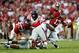 TUSCALOOSA, AL - SEPTEMBER 28: Kenyan Drake #17 of the Alabama Crimson Tide fumbles the ball as he is tackled by Woodrow Hamilton #56 of the Mississippi Rebels at Bryant-Denny Stadium on September 28, 2013 in Tuscaloosa, Alabama. (Photo by Kevin C. Cox/Getty Images)