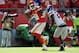 Sep 29, 2013; Kansas City, MO, USA; New York Giants strong safety Antrel Rolle (26) misses a tackle as Kansas City Chiefs wide receiver Dwayne Bowe (82) scores a touchdown during the second half at Arrowhead Stadium. The Chiefs won 31-7. Mandatory Credit: Denny Medley-USA TODAY Sports
