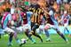 HULL, ENGLAND - OCTOBER 05: Yannick Sagbo of Hull is tackled by Ron Vlaar (L) and Ciaran Clark (R) of Aston Villa during the Barclays Premier League match between Hull City and Aston Villa at KC Stadium on October 5, 2013 in Hull, England. (Photo by Julian Finney/Getty Images)