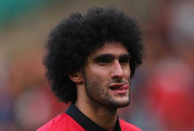 Hi-res-182110307-marouane-fellaini-of-manchester-united-looks-dejected_crop_north