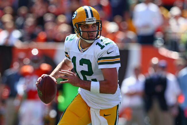 Hi-res-181566298-aaron-rodgers-of-the-green-bay-packers-runs-with-the_crop_north