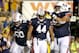 Sep 21, 2013; Baton Rouge, LA, USA; Auburn Tigers running back Cameron Artis-Payne (44) with teammates center Reese Dismukes (50) and offensive linesman Chad Slade (62) during the second half of a game at Tiger Stadium. LSU defeated Auburn 35-21. Mandatory Credit: Derick E. Hingle-USA TODAY Sports