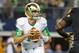 Oct 5, 2013; Arlington, TX, USA; Notre Dame Fighting Irish quarterback Tommy Rees (11) drops back in the first quarter against the Arizona State Sun Devils at AT&T Stadium. Mandatory Credit: Matt Cashore-USA TODAY Sports
