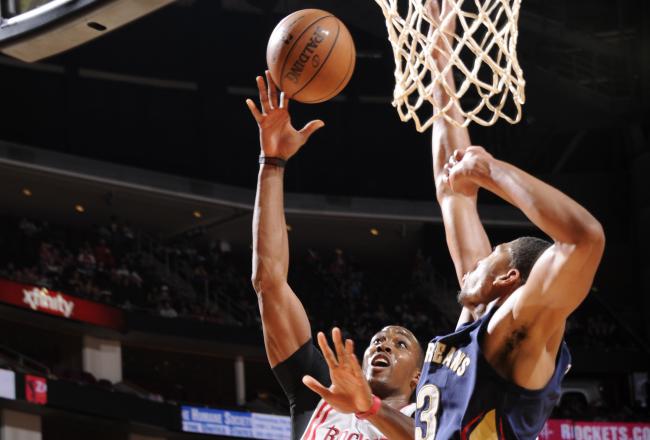 Hi-res-183196176-dwight-howard-of-the-houston-rockets-goes-up-to-the-rim_crop_north