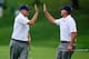 DUBLIN, OH - OCTOBER 06: Steve Stricker (L) and Bill Haas of the U.S. Team celebrate winning the 14th hole during the weather-delayed Day Three Foursome Matches at the Muirfield Village Golf Club on October 6, 2013 in Dublin, Ohio. (Photo by Matt Sullivan/Getty Images)