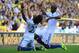 NORWICH, ENGLAND - OCTOBER 06: Willian of Chelsea celebrates scoring their third goal with Ramires of Chelsea during the Barclays Premier League match between Norwich City and Chelsea at Carrow Road on October 6, 2013 in Norwich, England. (Photo by Jamie McDonald/Getty Images)