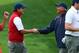 Oct 6, 2013; Dublin, OH, USA; Phil Mickelson and Fred Couple celebrate after Mickelson and Keegan Bradley (not pictured) halved their match during the third round of the Presidents Cup at Muirfield Village Golf Club. Mandatory Credit: Allan Henry-USA TODAY Sports