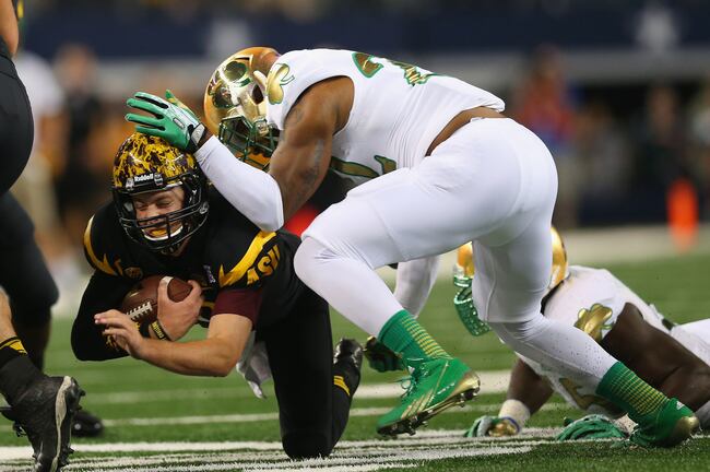 Hi-res-183200948-taylor-kelly-of-the-arizona-state-sun-devils-is-tackled_crop_north