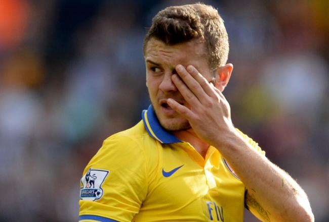 Hi-res-183436324-jack-wilshere-of-arsenal-looks-on-as-he-injures-his-eye_crop_north