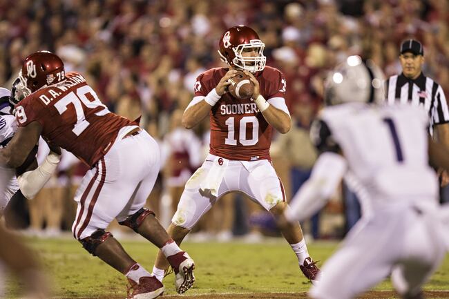 Hi-res-183200673-blake-bell-of-the-oklahoma-sooners-drops-back-to-pass_crop_north