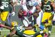 Oct 6, 2013; Green Bay, WI, USA; Detroit Lions running back Joique Bell (35) runs with the ball as Green Bay Packers defensive end Datone Jones (95) defends during the first quarter at Lambeau Field. Mandatory Credit: Jeff Hanisch-USA TODAY Sports