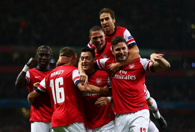 Hi-res-182601297-mesut-oezil-of-arsenal-is-congratulated-by-teammates_crop_north