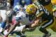 GREEN BAY, WI - OCTOBER 6: Clay Matthews #52 of the Green Bay Packers makes a tackle on Reggie Bush #21 of the Detroit Lions at Lambeau Field on October 6, 2013 in Green Bay, Wisconsin. (Photo Tom Lynn /Getty Images)