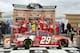 KANSAS CITY, KS - OCTOBER 06: Kevin Harvick, driver of the #29 Budweiser Chevrolet, celebrates in Victory Lane after winning the NASCAR Sprint Cup Series 13th Annual Hollywood Casino 400 at Kansas Speedway on October 6, 2013 in Kansas City, Kansas. (Photo by Jerry Markland/Getty Images)