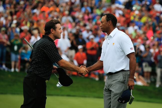 Hi-res-183449821-tiger-woods-of-the-u-s-team-shakes-hands-with-richard_crop_north
