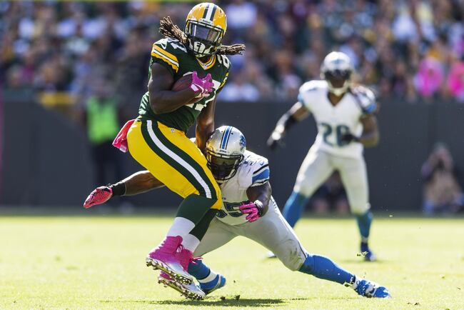 Hi-res-183447615-eddie-lacy-of-the-green-bay-packers-tries-to-spin-away_crop_north