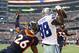 Oct 6, 2013; Arlington, TX, USA; Dallas Cowboys receiver Dez Bryant (88) catches a first quarter touchdown against Denver Broncos safety Rahim Moore (26) at AT&T Stadium. Mandatory Credit: Matthew Emmons-USA TODAY Sports