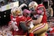 Oct 6, 2013; San Francisco, CA, USA; San Francisco 49ers running back Anthony Dixon (right) is congratulated by teammates after scoring a touchdown against the Houston Texans in the second quarter at Candlestick Park. Mandatory Credit: Cary Edmondson-USA TODAY Sports