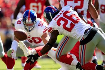 Hi-res-182322685-strong-safety-antrel-rolle-and-middle-linebacker-mark_crop_north