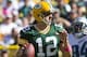 Oct 6, 2013; Green Bay, WI, USA; Green Bay Packers quarterback Aaron Rodgers (12) drops back to pass the ball during the second quarter against the Detroit Lions at Lambeau Field. Mandatory Credit: Jeff Hanisch-USA TODAY Sports