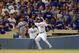 October 6, 2013; Los Angeles, CA, USA; Los Angeles Dodgers left fielder Carl Crawford (25) catches a fly ball in foul territory in the eighth inning against the Atlanta Braves in game three of the National League divisional series playoff baseball game at Dodger Stadium. Mandatory Credit: Jayne Kamin-Oncea-USA TODAY Sports