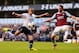 LONDON, ENGLAND - OCTOBER 06: Andros Townsend of Tottenham (L) shoots under pressure from Razvan Rat of West Ham during the Barclays Premier League match between Tottenham Hotspur and West Ham United at White Hart Lane on October 6, 2013 in London, England. (Photo by Mike Hewitt/Getty Images)