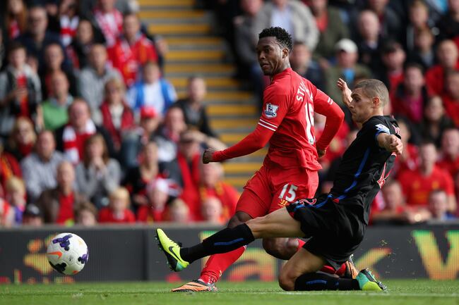 Hi-res-183154255-daniel-sturridge-of-liverpool-shoots-past-stuart-okeefe_crop_north