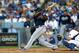 LOS ANGELES, CA - OCTOBER 06: Justin Upton #8 of the Atlanta Braves hits a single in the third inning against the Los Angeles Dodgers during Game Three of the National League Division Series at Dodger Stadium on October 6, 2013 in Los Angeles, California. (Photo by Victor Decolongon/Getty Images)