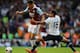 LONDON, ENGLAND - OCTOBER 06: Ravel Morrison of West Ham (L) avoids the tackle of Kyle Naughton of Tottenham during the Barclays Premier League match between Tottenham Hotspur and West Ham United at White Hart Lane on October 6, 2013 in London, England. (Photo by Mike Hewitt/Getty Images)