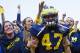 November 10, 2012; Ann Arbor, MI, USA; Michigan Wolverines linebacker Jake Ryan (47) celebrates with fans after the game against the Northwestern Wildcats at Michigan Stadium. Michigan won 38-31 in overtime. Mandatory Credit: Rick Osentoski-USA TODAY Sports