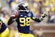 Oct 5, 2013; Ann Arbor, MI, USA; Michigan Wolverines quarterback Devin Gardner (98) passes the ball in the second quarter against the Minnesota Golden Gophers at Michigan Stadium. Mandatory Credit: Rick Osentoski-USA TODAY Sports