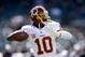 OAKLAND, CA - SEPTEMBER 29: Robert Griffin III #10 of the Washington Redskins warms up before their game against the Oakland Raiders at O.co Coliseum on September 29, 2013 in Oakland, California. (Photo by Ezra Shaw/Getty Images)
