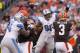 CLEVELAND, OH - AUGUST 15: Defensive tackle Ndamukong Suh #90 of the Detroit Lions tries to block quarterback Brandon Weeden #3 of the Cleveland Browns during the first half of a preseason at FirstEnergy Stadium on August 15, 2013 in Cleveland, Ohio. (Photo by Jason Miller/Getty Images)