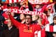 LIVERPOOL, ENGLAND - OCTOBER 05: A Liverpool fan sings during the Barclays Premier League match between Liverpool and Crystal Palace at Anfield on October 5, 2013 in Liverpool, England. (Photo by Clive Brunskill/Getty Images)