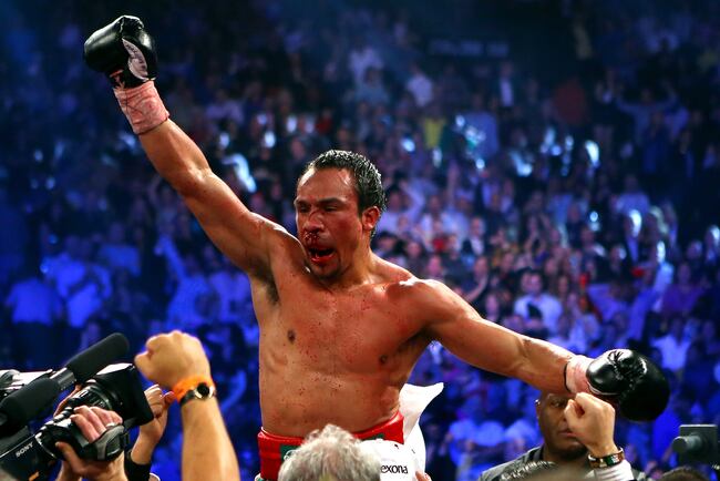 Hi-res-158016492-juan-manuel-marquez-celebrates-after-defeating-manny_crop_north