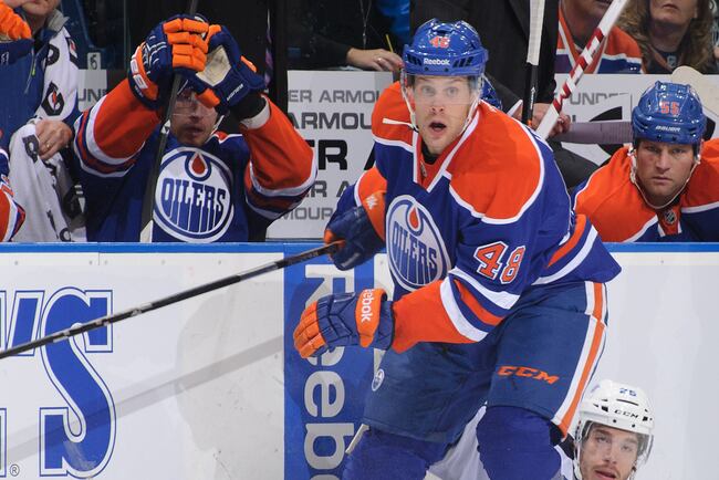 Hi-res-181714401-ryan-hamilton-of-the-edmonton-oilers-knocks-zach_crop_north