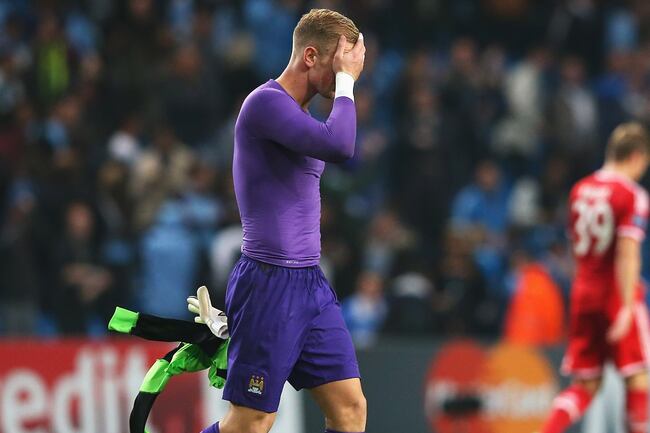 Hi-res-182936452-goalkeeper-joe-hart-of-manchester-city-holds-his-head_crop_north