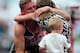 LONDON, ENGLAND - JULY 28: David Weir of Great Britain is greeted by his family after winning in the Mens T54 Mile during day three of the Sainsbury's Anniversary Games - IAAF Diamond League 2013 at The Queen Elizabeth Olympic Park on July 28, 2013 in London, England. (Photo by Jamie McDonald/Getty Images)