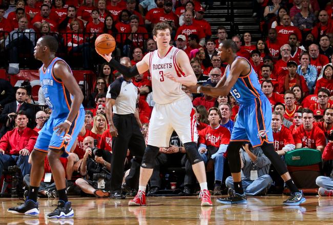 Hi-res-168005749-omer-asik-of-the-houston-rockets-looks-to-pass-the-ball_crop_north