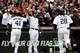 DETROIT, MI - OCTOBER 07: Victor Martinez #41 of the Detroit Tigers celebrates scoring in the fourth inning with Alex Avila #13 against the Oakland Athletics during Game Three of the American League Division Series at Comerica Park on October 7, 2013 in Detroit, Michigan. (Photo by Leon Halip/Getty Images)