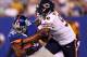 EAST RUTHERFORD, NJ - AUGUST 24: Julius Peppers #90 of the Chicago Bears shoves Rueben Randle #82 of the New York Giants during a preseason game on August 24, 2012 at MetLife Stadium in East Rutherford, New Jersey. (Photo by Elsa/Getty Images)