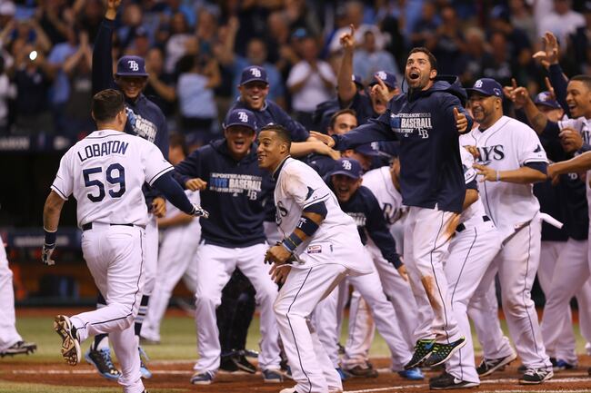 Hi-res-183602936-jose-lobaton-of-the-tampa-bay-rays-is-greeted-at-home_crop_north