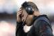 FOXBORO, MA - SEPTEMBER 22: Head coach Greg Schiano holds his head during the fourth quarter of their 23-3 loss to the New England Patriots at Gillette Stadium on September 22, 2013 in Foxboro, Massachusetts. (Photo by Winslow Townson/Getty Images)