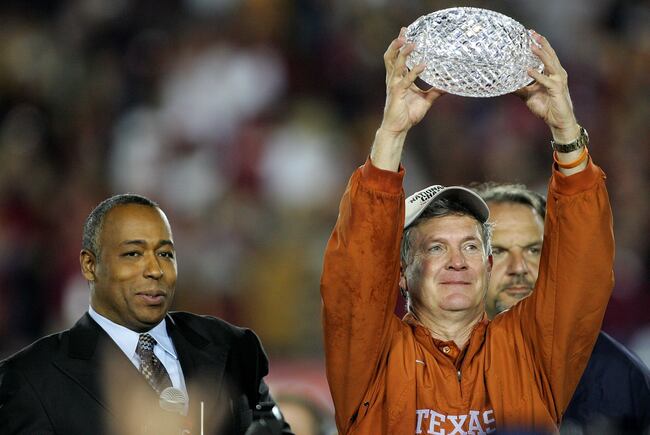 Hi-res-56525508-head-coach-mack-brown-of-the-texas-longhorns-holds-up_crop_north
